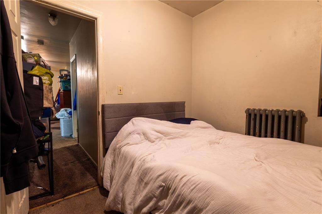 832 Broadway Avenue McKees Rocks, PA 15136 - Photo 22 of 48 a large bed in a bedroom next to a bedroom
