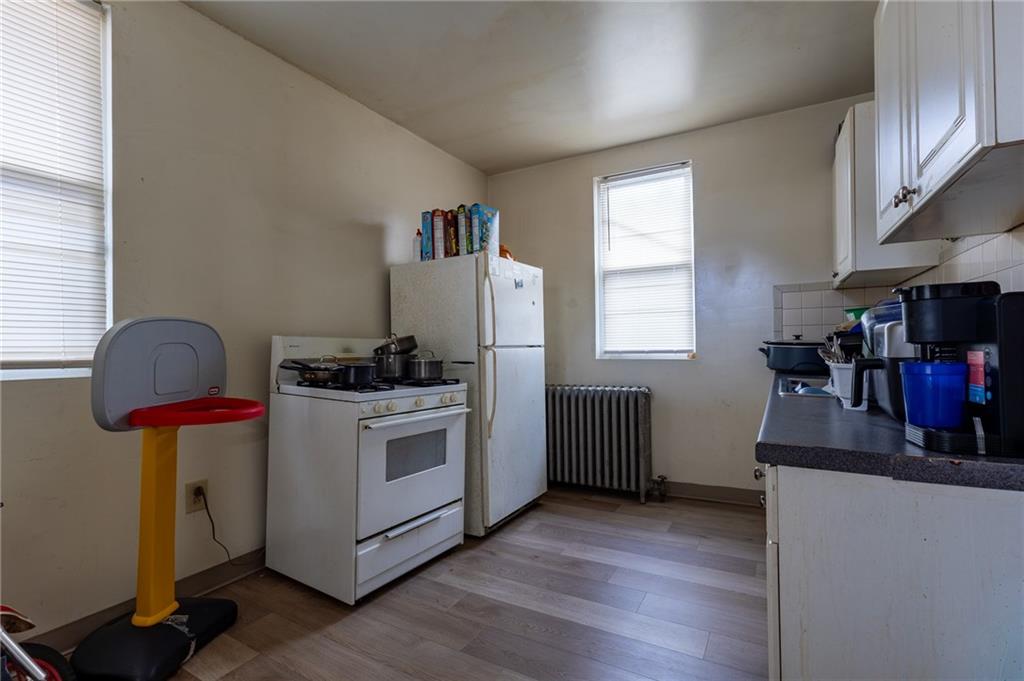 832 Broadway Avenue McKees Rocks, PA 15136 - Photo 27 of 48 a kitchen with sink a microwave and cabinets