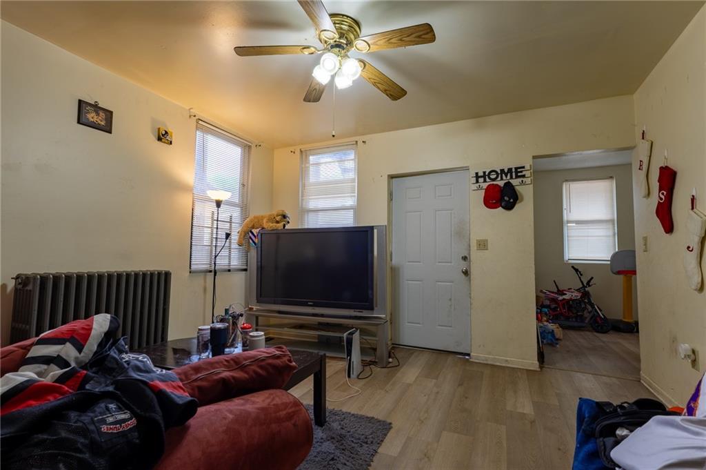 832 Broadway Avenue McKees Rocks, PA 15136 - Photo 30 of 48 a living room with furniture and a flat screen tv