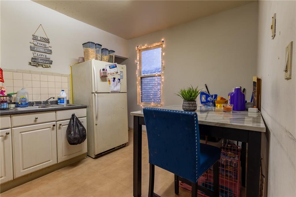 832 Broadway Avenue McKees Rocks, PA 15136 - Photo 41 of 48 a kitchen with stainless steel appliances granite countertop a refrigerator and a stove