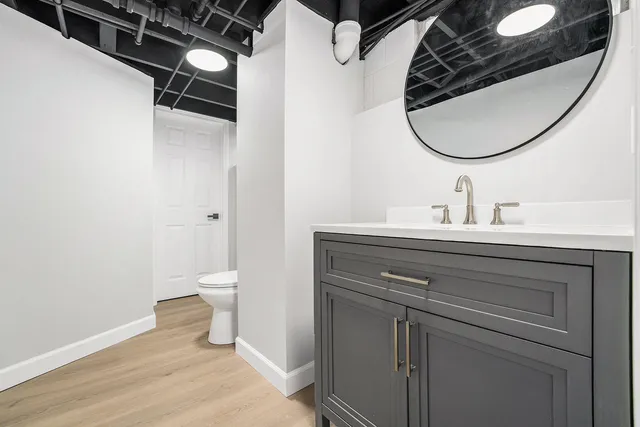 a view of backyard with tree and wooden fence