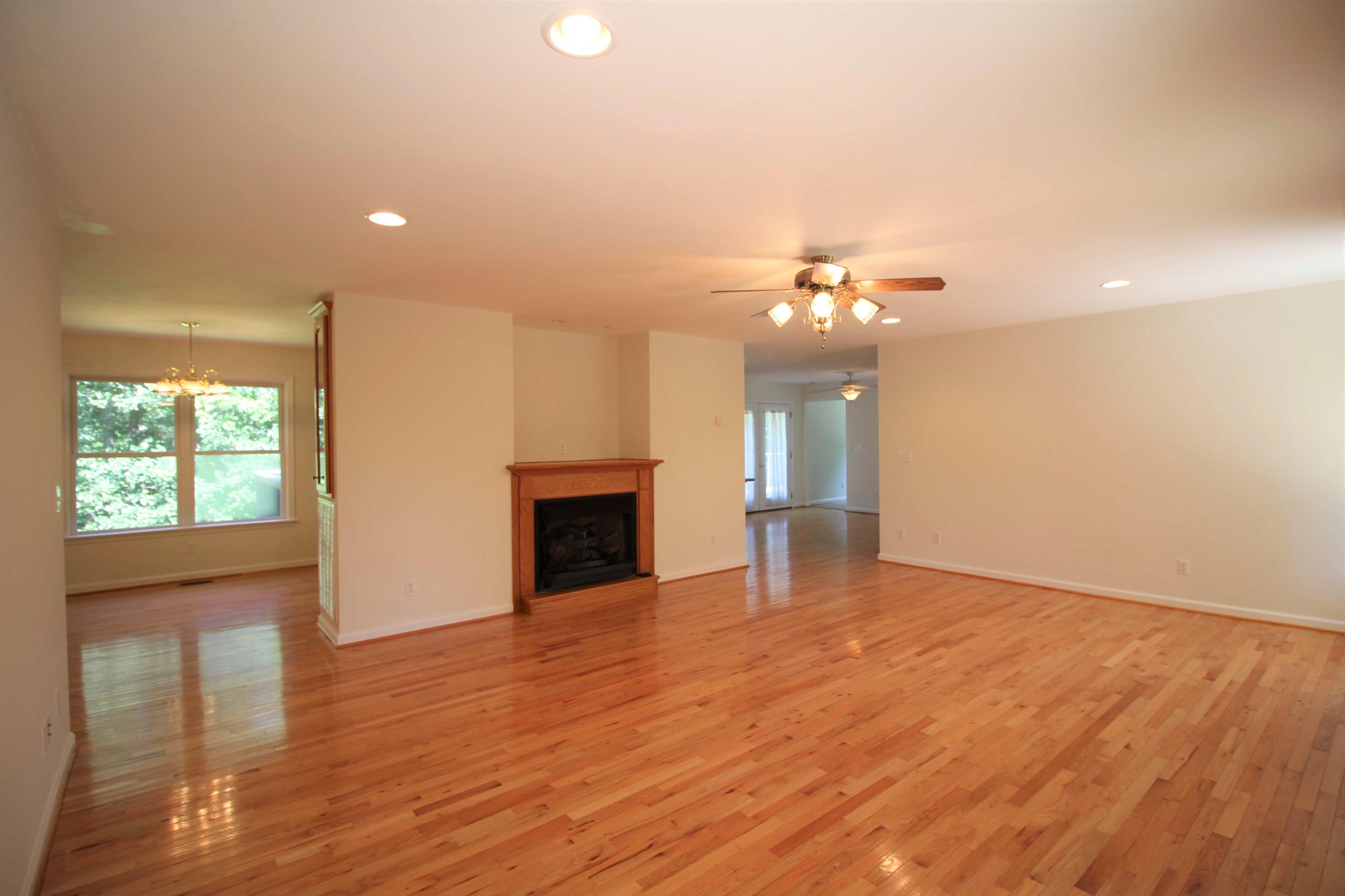 415 Green Level Road Boones Mill, VA 24065 - Photo 4 of 48 a view of an empty room with wooden floor and a window