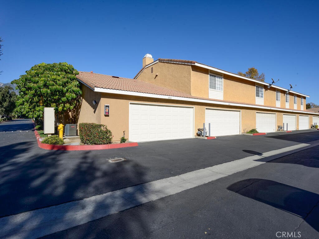 10074 Base Line Road Rancho Cucamonga, CA 91701 - Photo 13 of 18 a view of a house with a street
