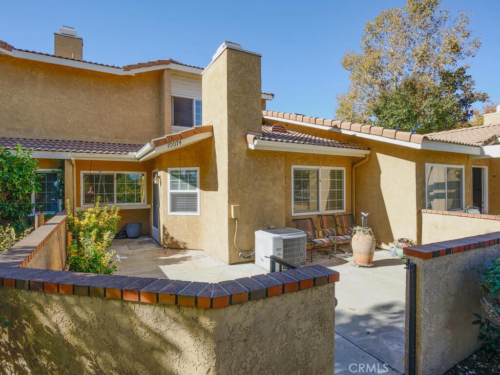 10074 Base Line Road Rancho Cucamonga, CA 91701 - Photo 18 of 18 a front view of a house with swimming pool and glass windows