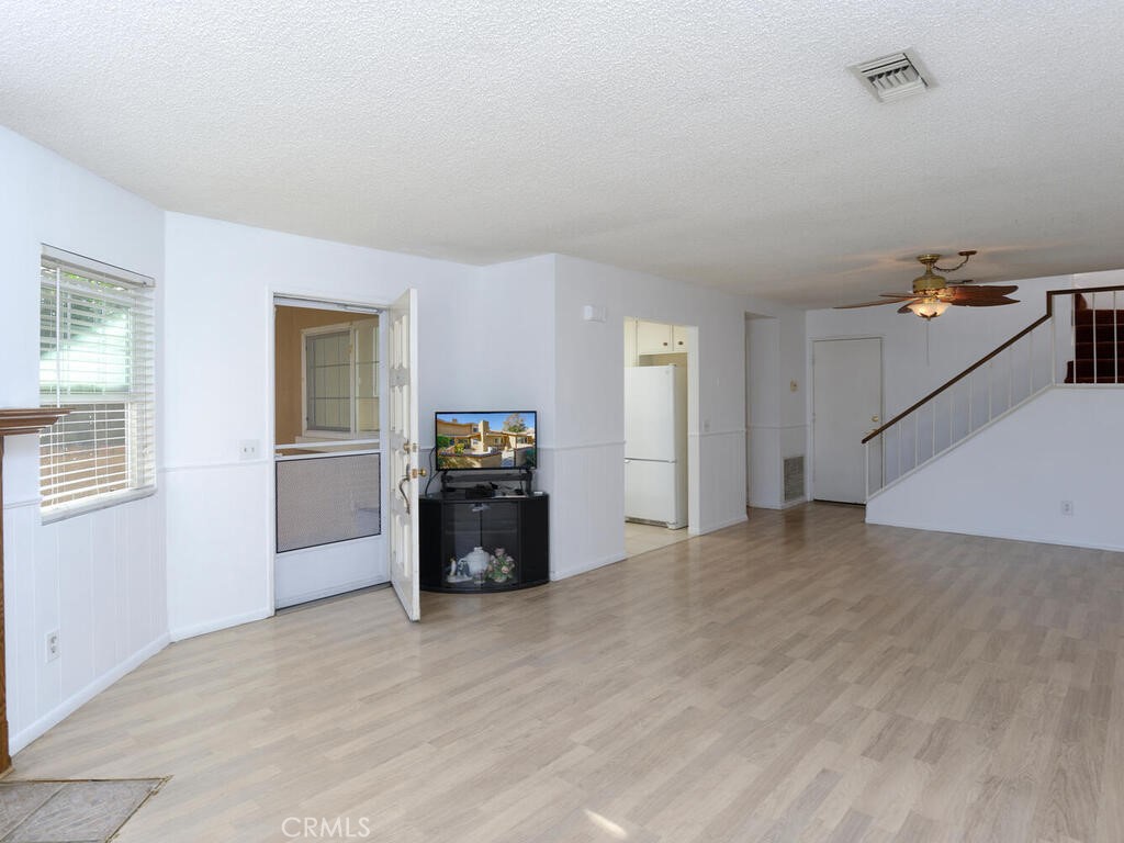 10074 Base Line Road Rancho Cucamonga, CA 91701 - Photo 2 of 18 a view of a livingroom with a kitchen