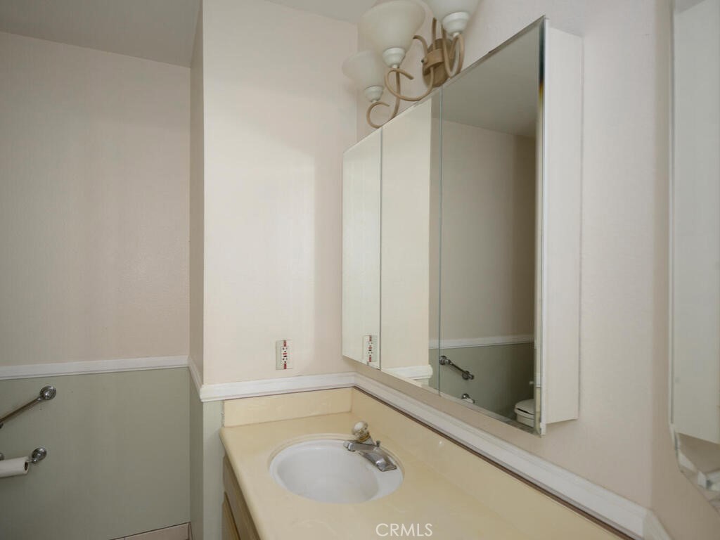 10074 Base Line Road Rancho Cucamonga, CA 91701 - Photo 6 of 18 a bathroom with a sink and a mirror