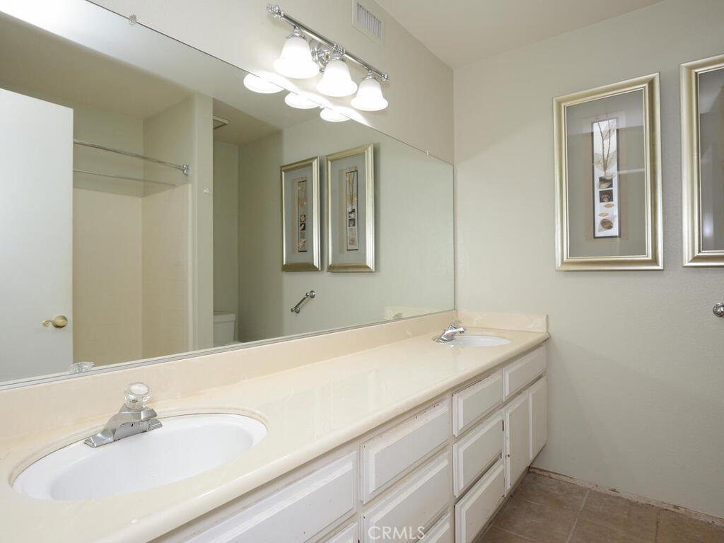 10074 Base Line Road Rancho Cucamonga, CA 91701 - Photo 8 of 18 a bathroom with a sink and a mirror
