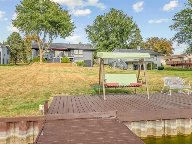 a kitchen with stainless steel appliances granite countertop a stove a sink a microwave and a refrigerator