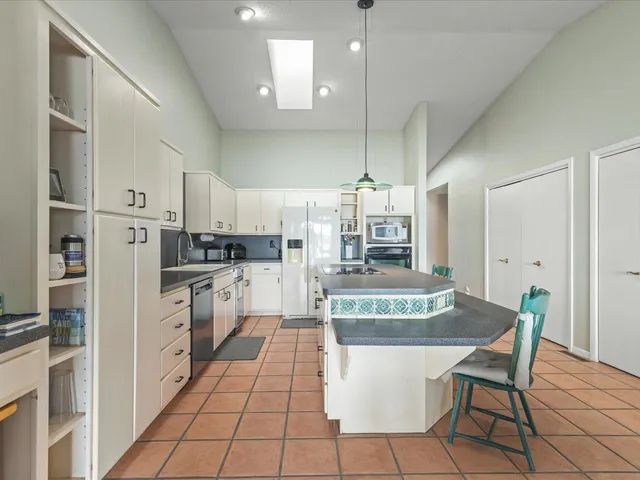 a view of a room with window and hardwood floor
