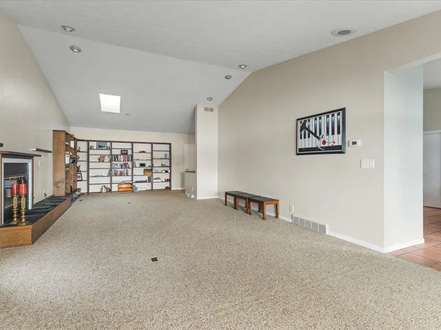 a view of an empty room and window