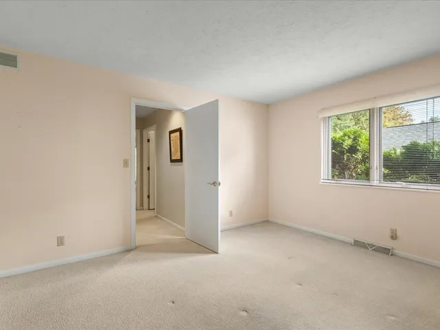 a view of empty room with windows