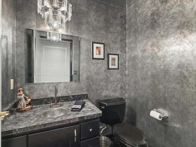 a bedroom with a bed and a lamp