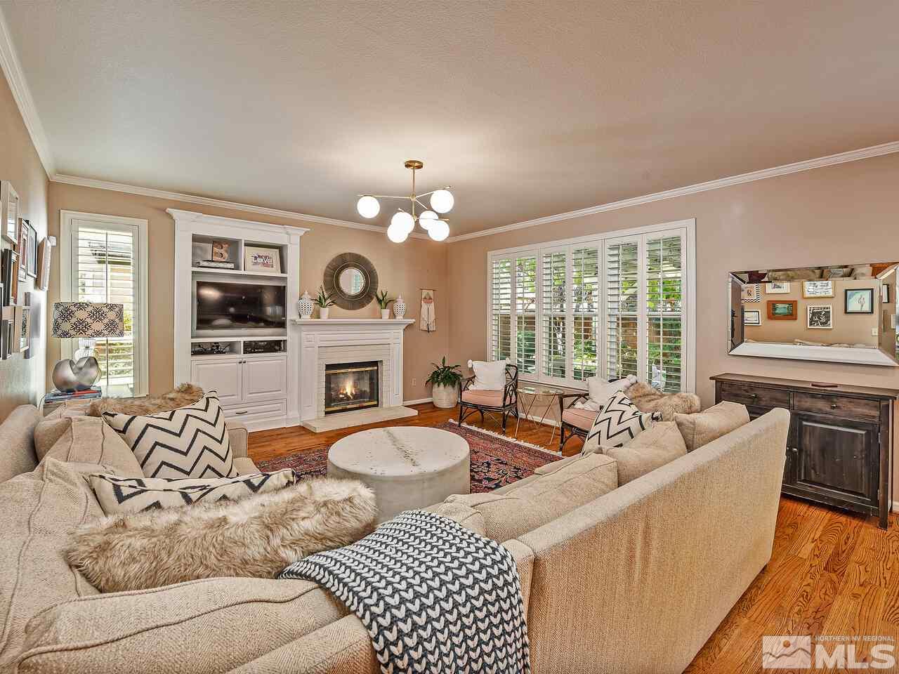 4075 Falling Water Drive Reno, NV 89519 - Photo 10 of 25 a living room with furniture large window and wooden floor