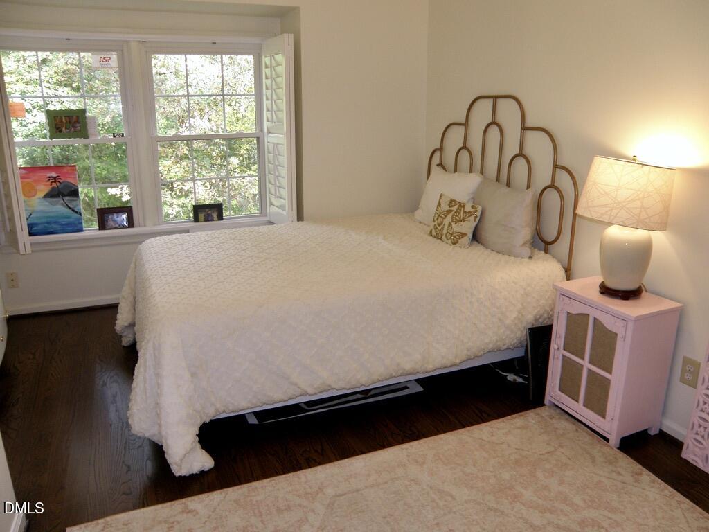 2858 Wycliff Road Raleigh, NC 27607 - Photo 20 of 26 a bedroom with a bed and window