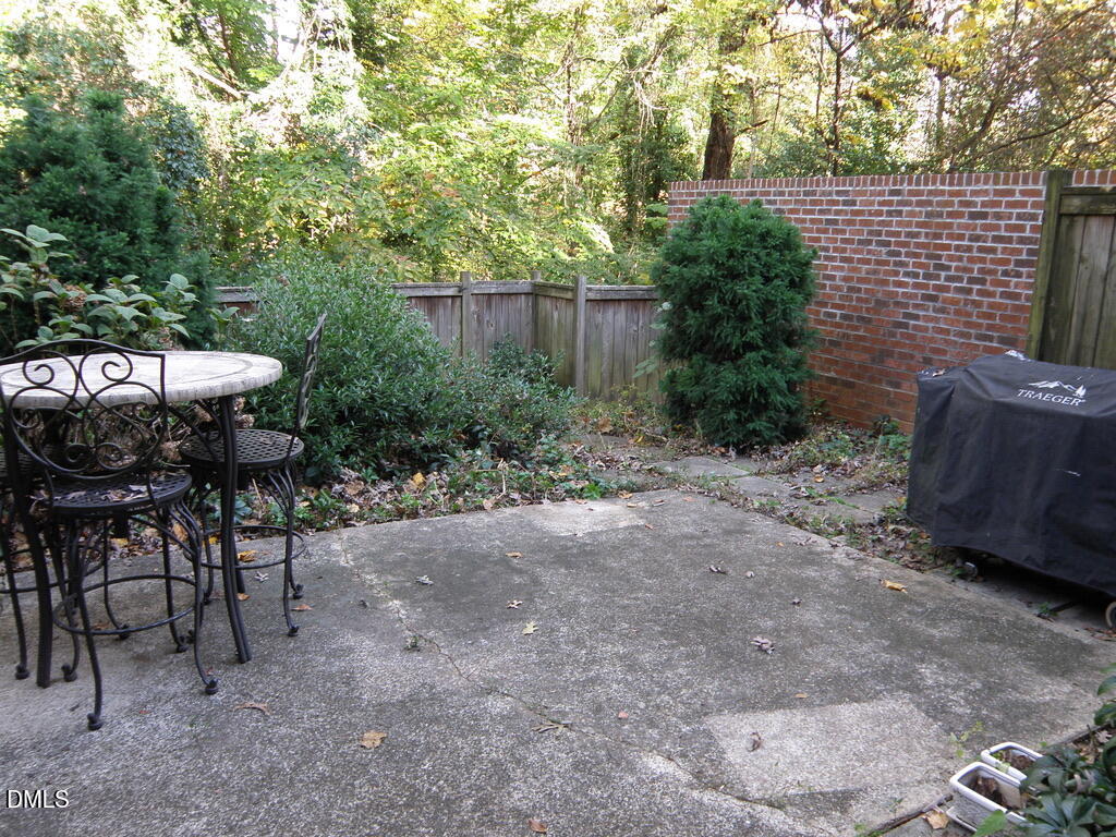 2858 Wycliff Road Raleigh, NC 27607 - Photo 23 of 26 a view of backyard with outdoor seating and trees