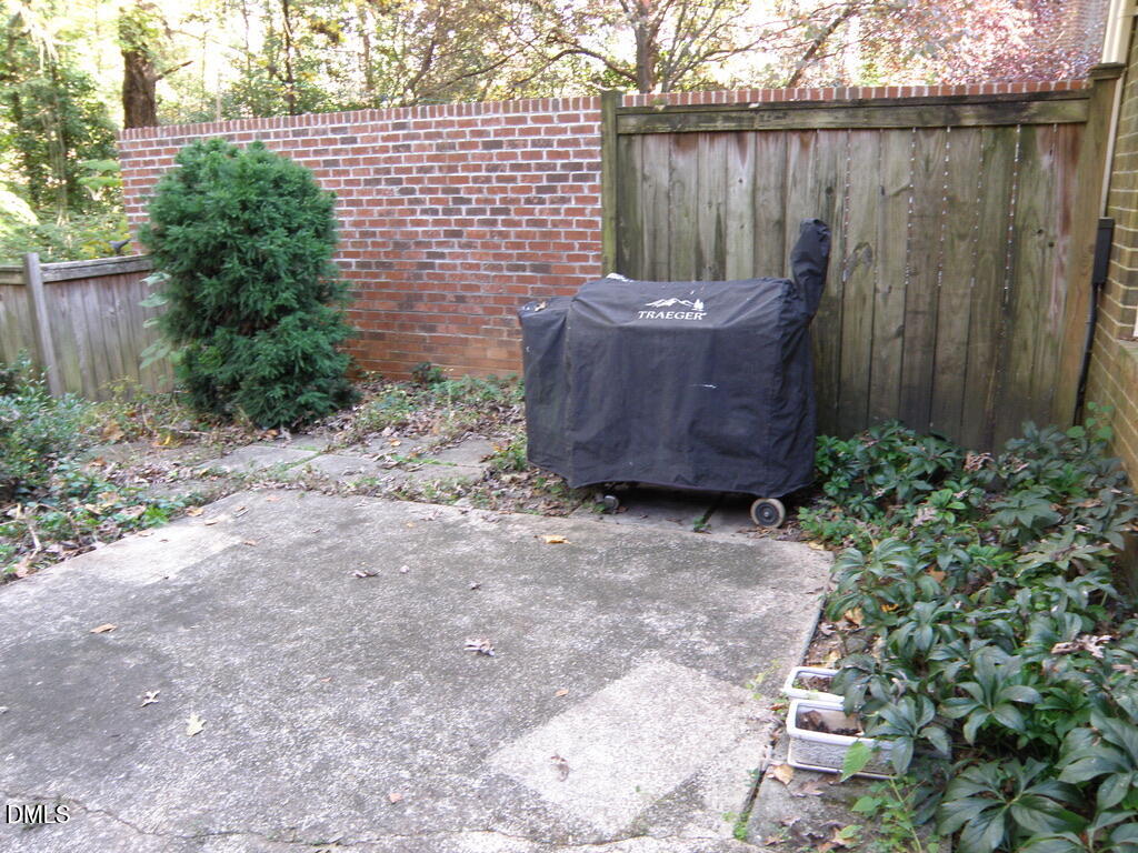 2858 Wycliff Road Raleigh, NC 27607 - Photo 24 of 26 a view of a backyard with potted plants