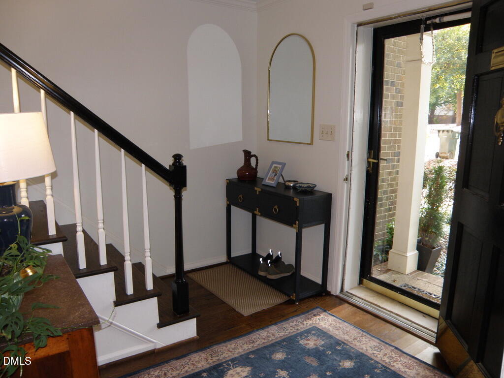 2858 Wycliff Road Raleigh, NC 27607 - Photo 4 of 26 a view of an entryway with wooden floor and windows