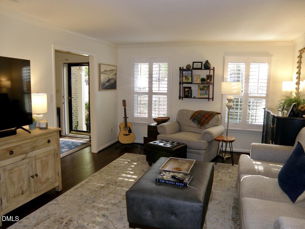 2858 Wycliff Road Raleigh, NC 27607 - Photo 7 of 26 a living room with furniture and a flat screen tv