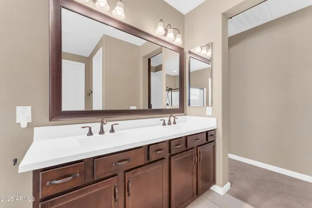 a bathroom with a shower and a mirror