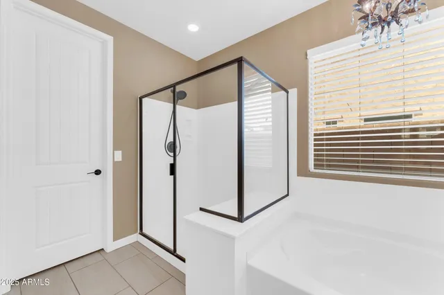 a bathroom with a bathtub and a shower