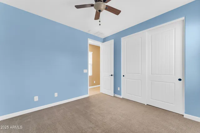a bathroom with a toilet a sink and a mirror