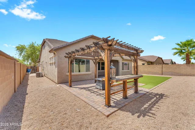 a view of a backyard with a tv