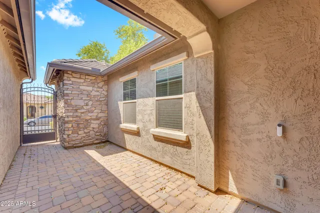 a view of bathroom with a shower and a sink