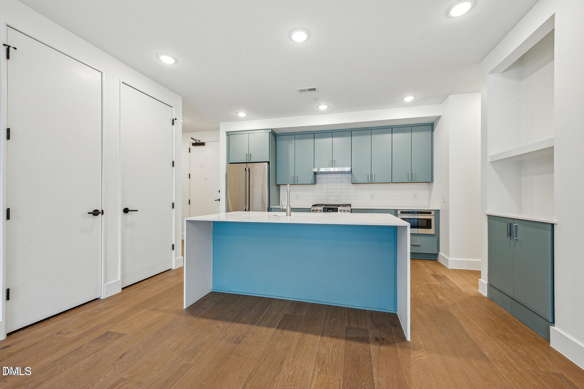 29 Enterprise Street, Unit 109 Raleigh, NC 27607 - Photo 4 of 18 a kitchen with stainless steel appliances granite countertop a refrigerator and a sink