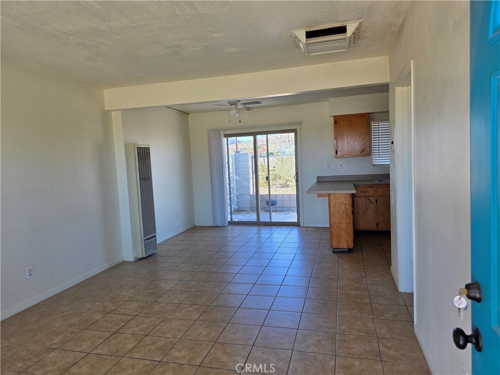 73636 Cactus Drive, Unit A Twentynine Palms, CA 92277 - Photo 2 of 8 a view of an empty room with window and wooden floor