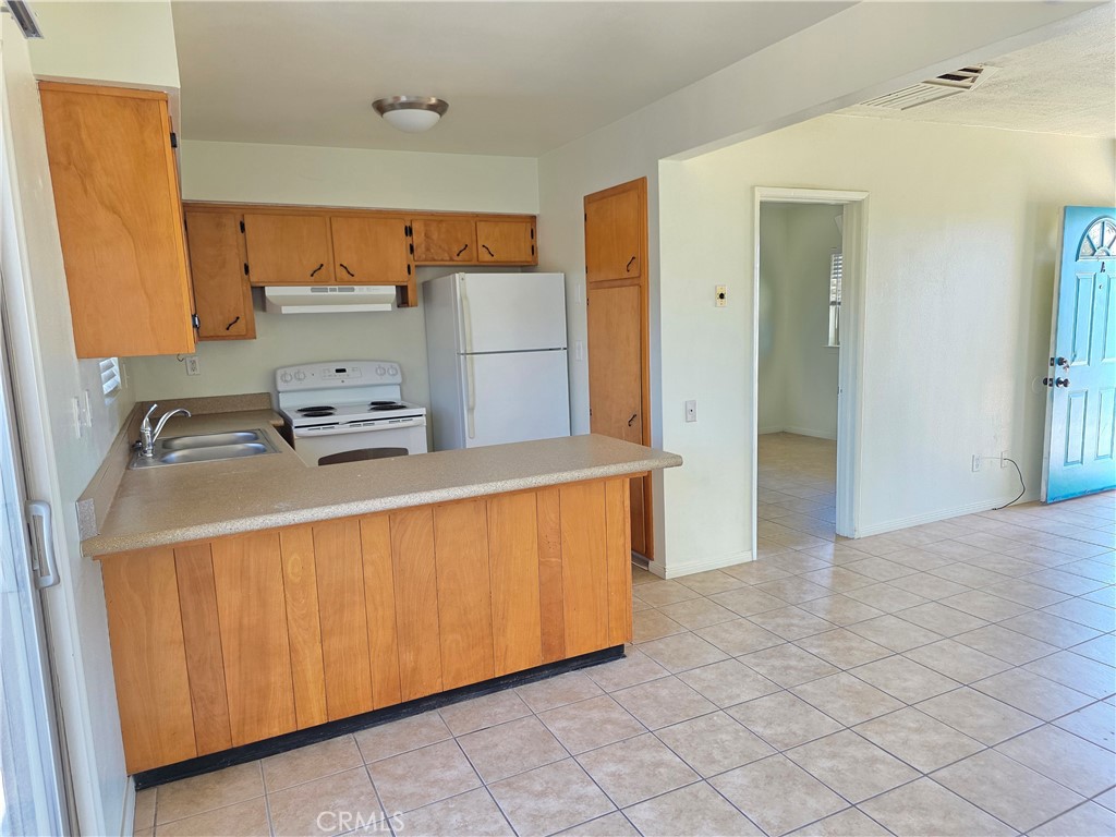 73636 Cactus Drive, Unit A Twentynine Palms, CA 92277 - Photo 3 of 8 a room with storage and utility