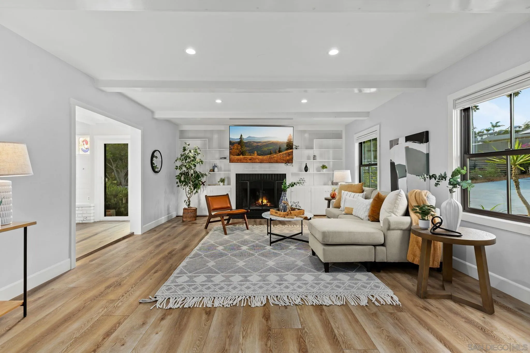 2335 Ivy Road Oceanside, CA 92054 - Photo 12 of 53 a living room with furniture and a fireplace