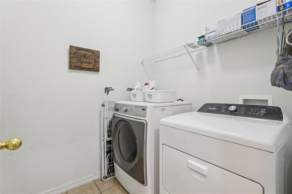 1689 Strathmore Circle Mount Dora, FL 32757 - Photo 20 of 37 a utility room with dryer and washer