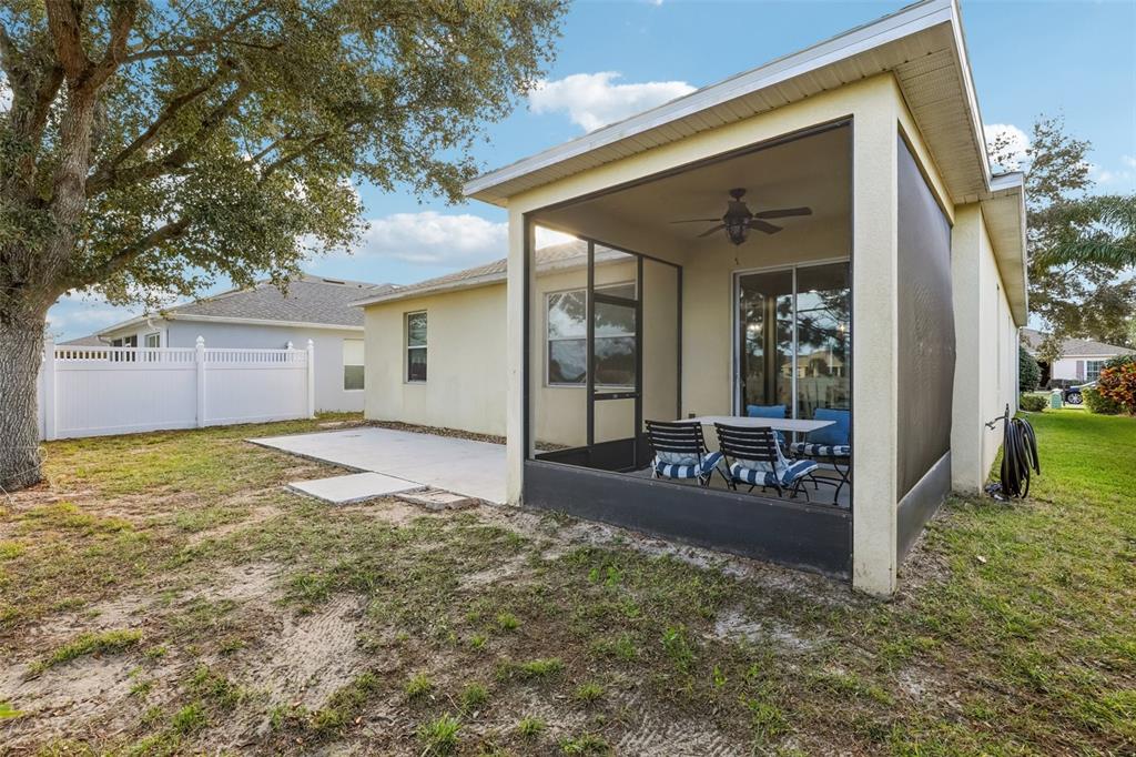 1689 Strathmore Circle Mount Dora, FL 32757 - Photo 34 of 37 a view of a house with backyard and porch