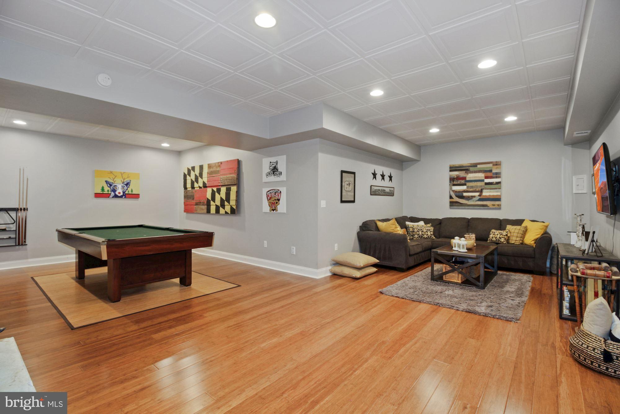 613 Old County Road Severna Park, MD 21146 - Photo 24 of 40 Huge basement rec room w/wood floors