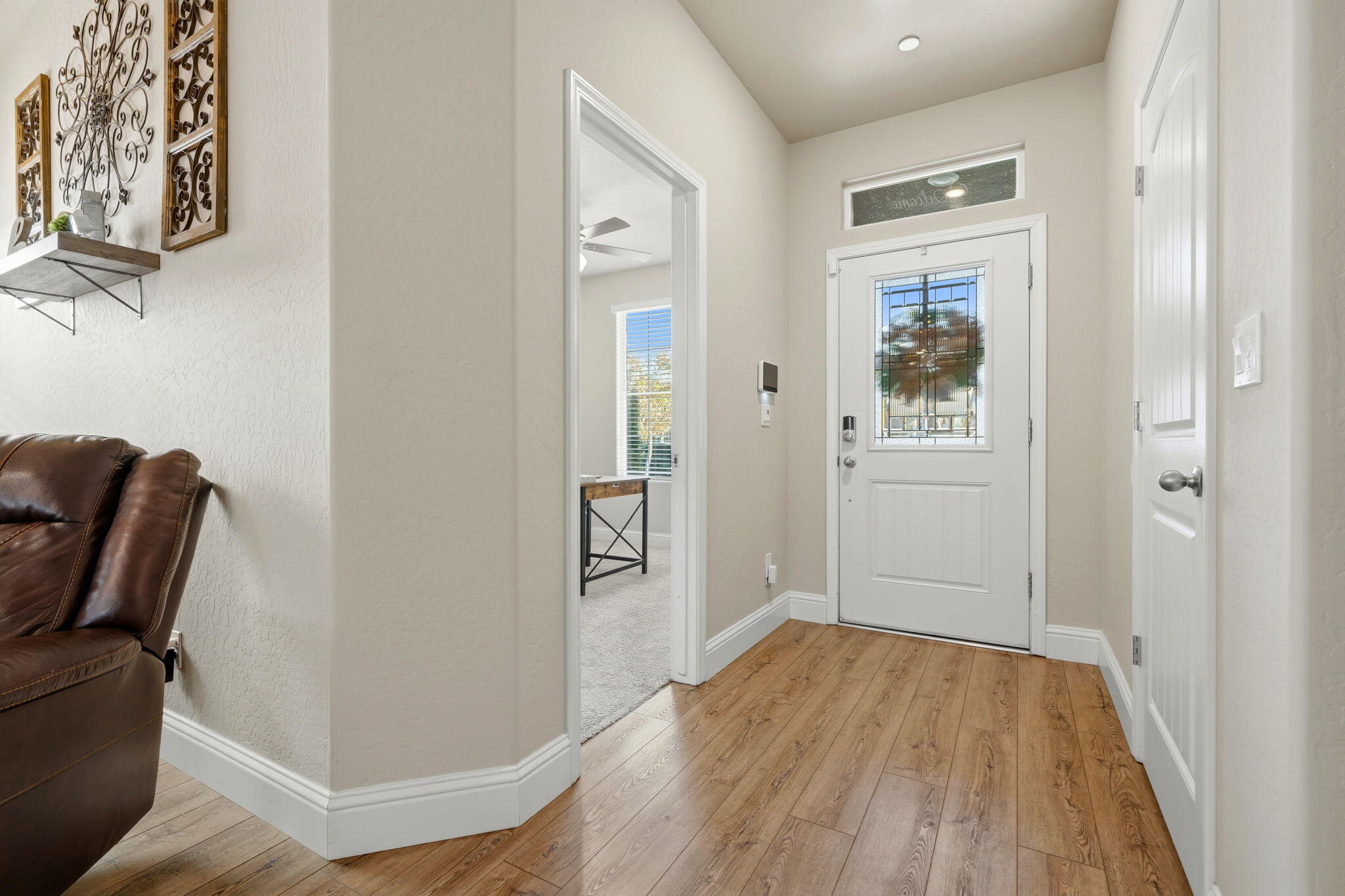 756 Strada Street Lemoore, CA 93245 - Photo 4 of 53 a view of room with window and wooden floor