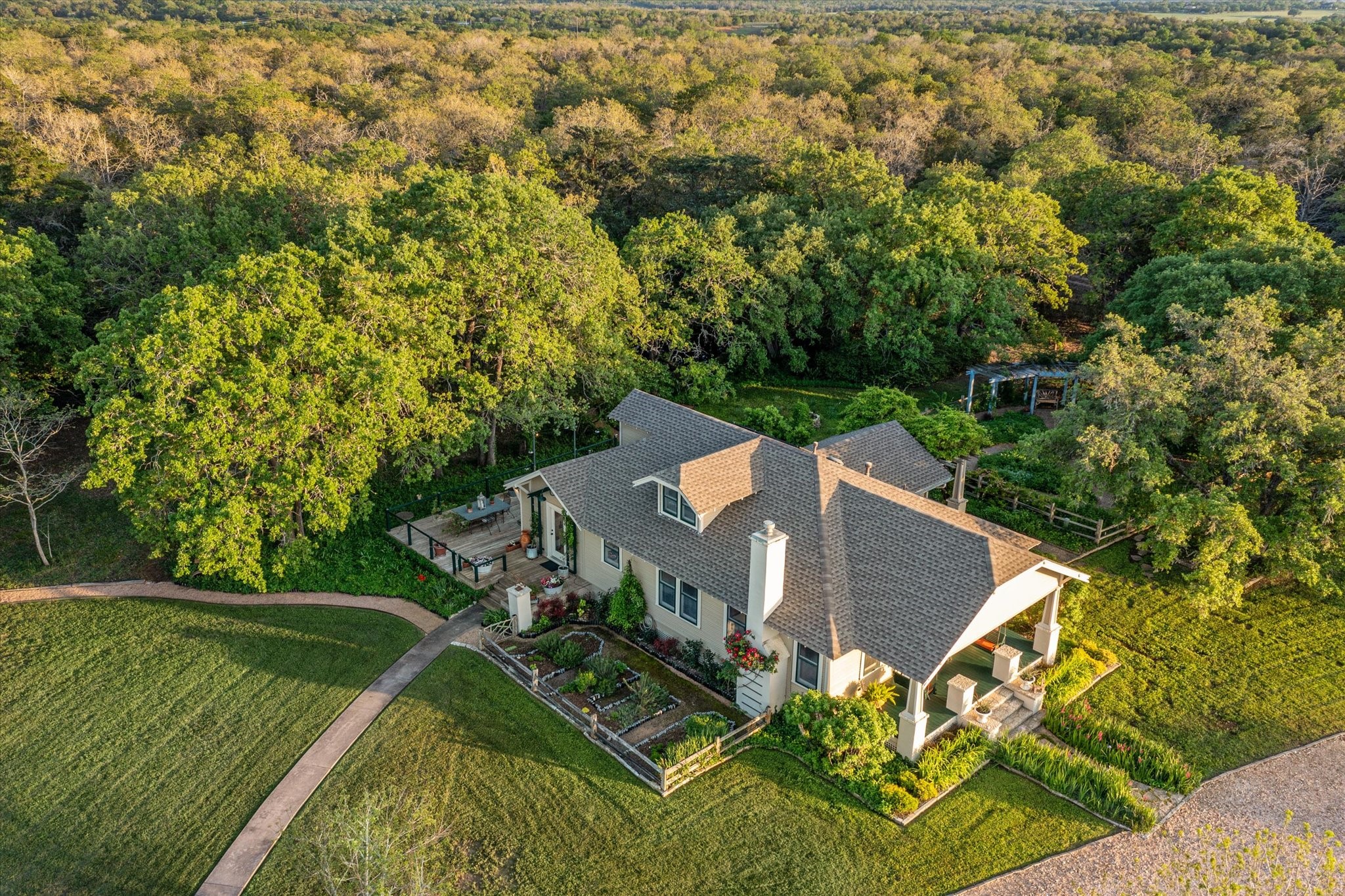 2915 Schulle Road Round Top, TX 78954 - Photo 4 of 50 Aerial View of the front and side garden to the main home.