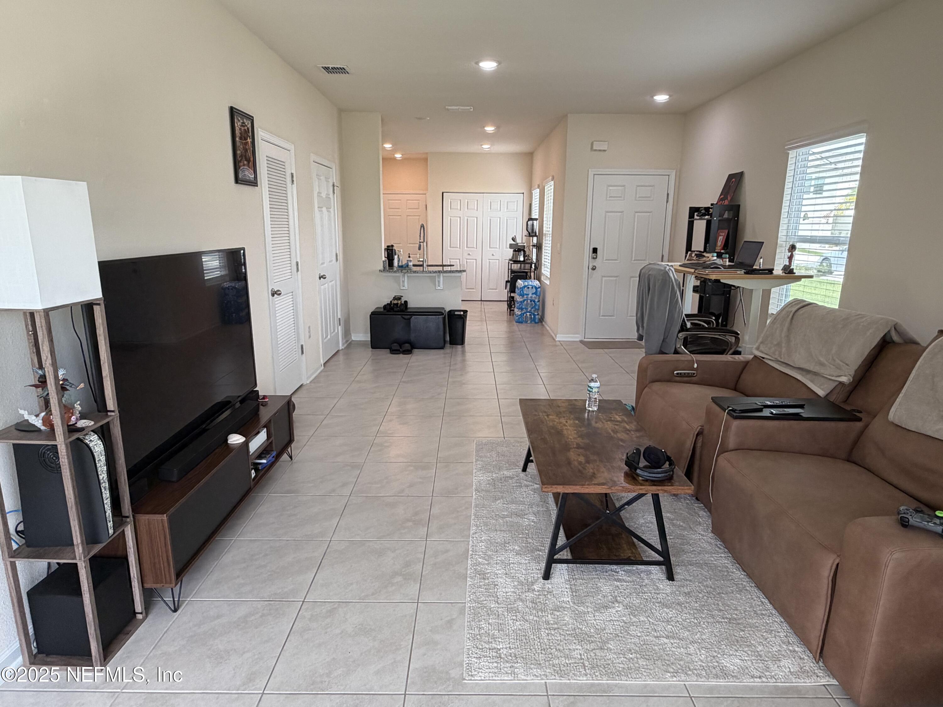 64 Java Lane St. Augustine, FL 32092 - Photo 12 of 38 a living room with furniture and a flat screen tv