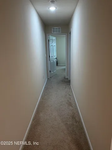 a room with a bed furniture and a window