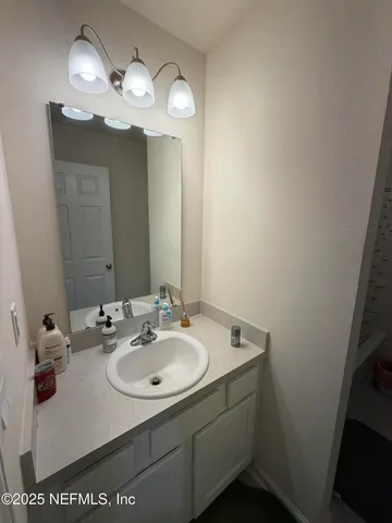 a bathroom with a sink and toilet