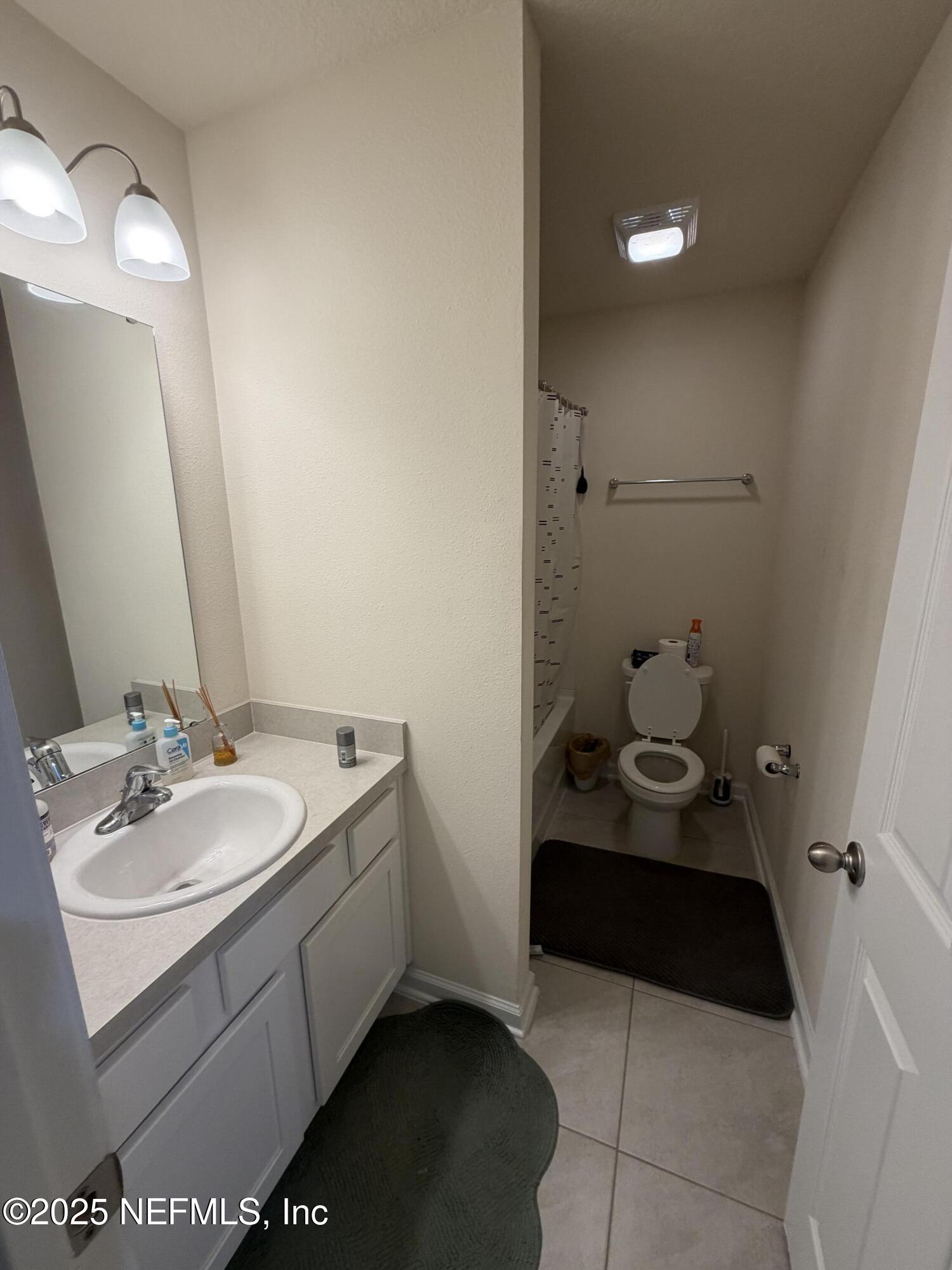 64 Java Lane St. Augustine, FL 32092 - Photo 29 of 38 a bathroom with a sink toilet and vanity