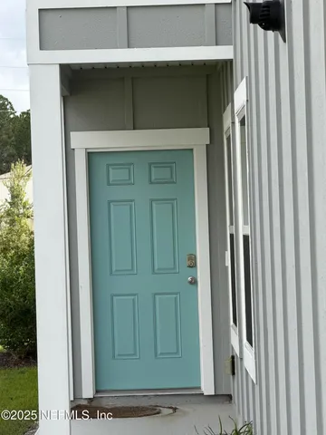 a kitchen with stainless steel appliances granite countertop a sink refrigerator and cabinets
