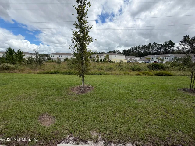 a view of a garden with houses