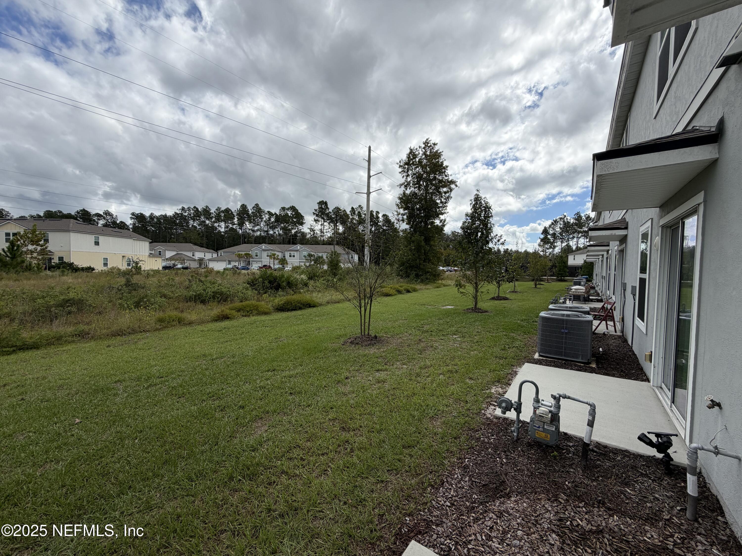 64 Java Lane St. Augustine, FL 32092 - Photo 32 of 38 a view of a garden with houses