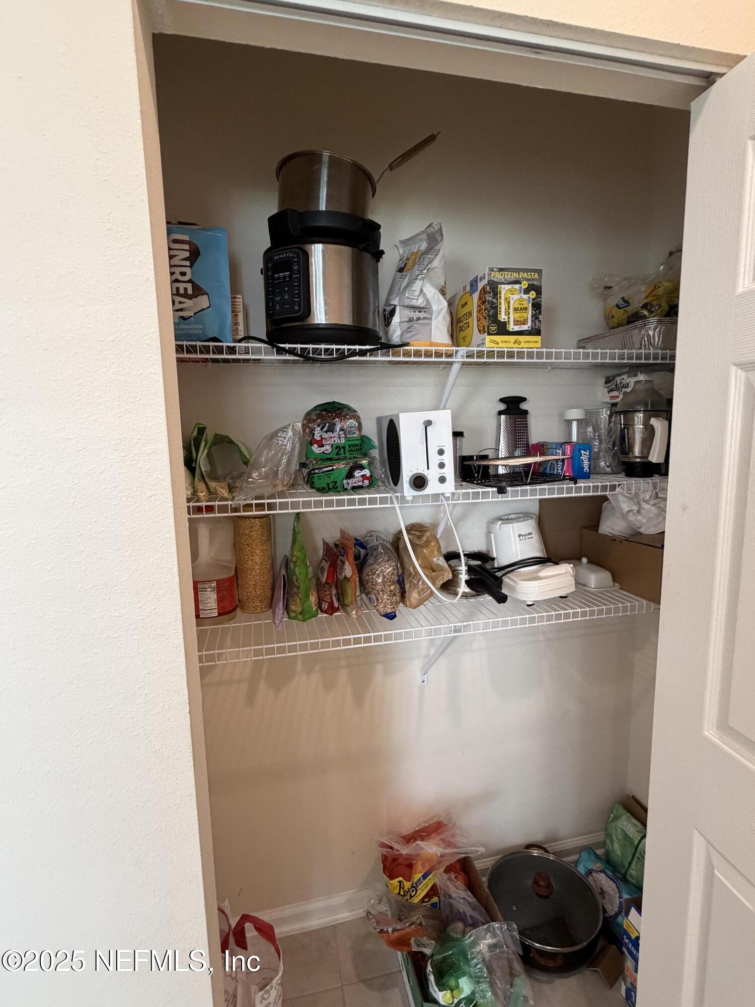 64 Java Lane St. Augustine, FL 32092 - Photo 8 of 38 a room with storage and utility