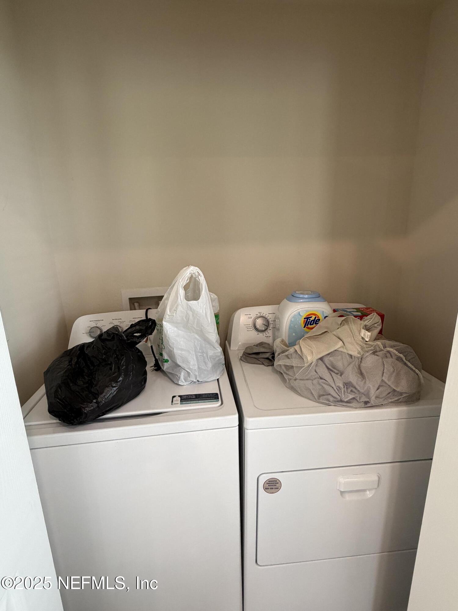 64 Java Lane St. Augustine, FL 32092 - Photo 9 of 38 a utility room with dryer and washer