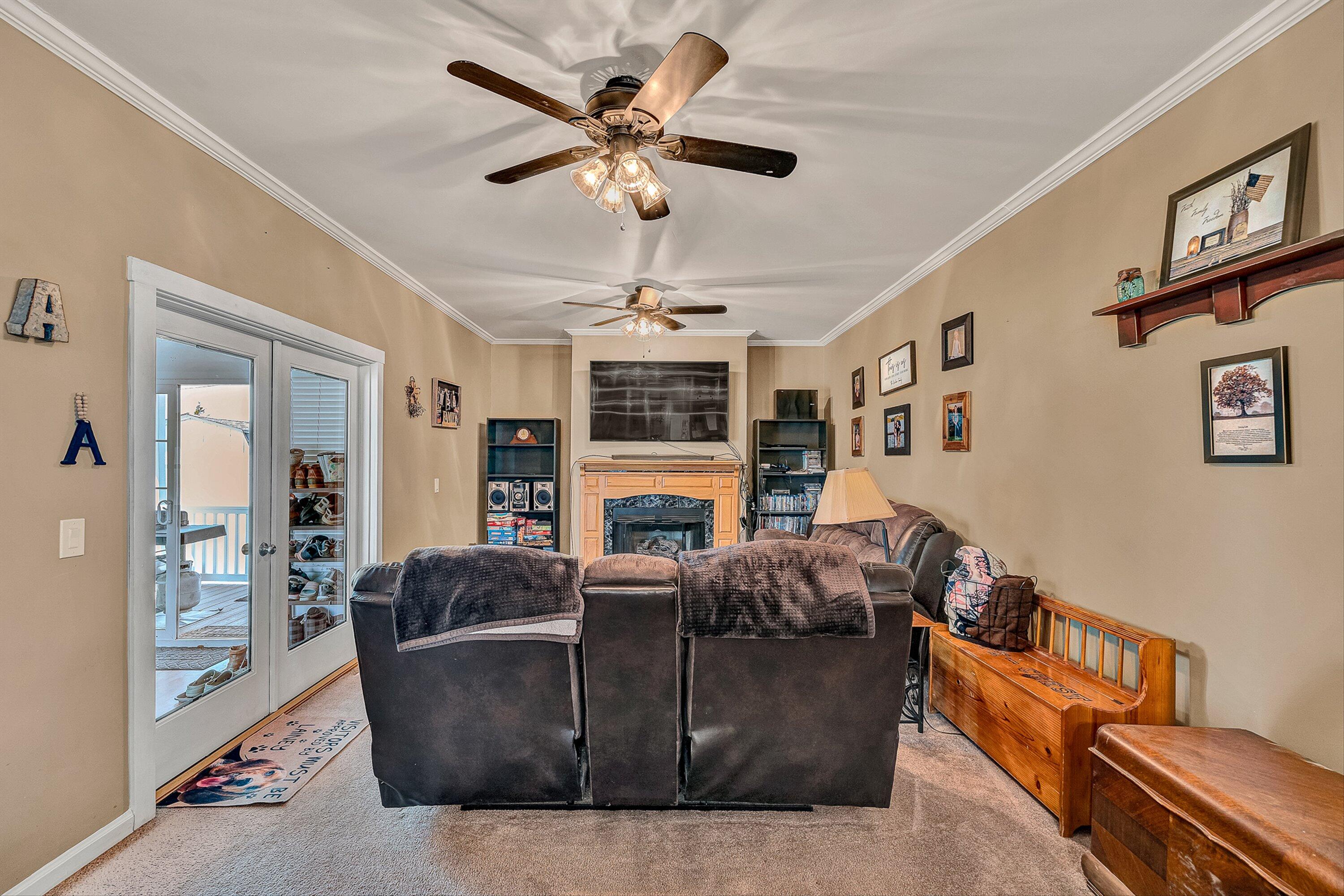 159 Simmons Creek Road Union Hall, VA 24176 - Photo 15 of 55 a living room with furniture ceiling fan and a rug