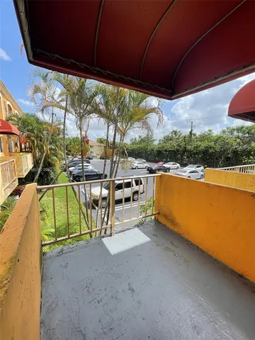 a bathroom with a toilet sink and shower