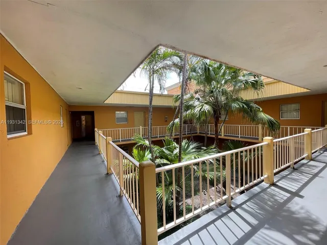 a view of balcony with wooden floor