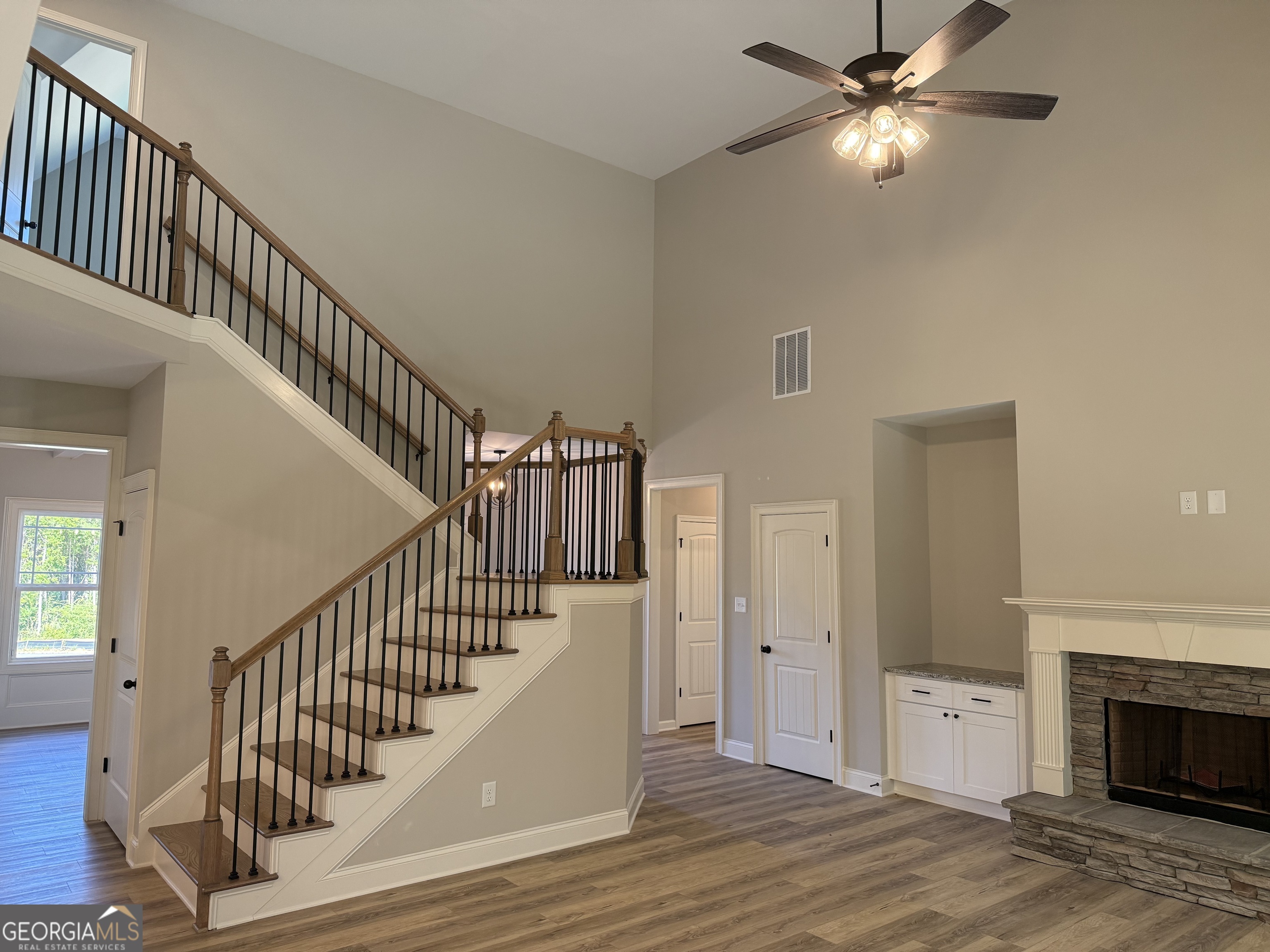92 Commanche Circle Williamson, GA 30292 - Photo 11 of 53 a view of empty room with wooden floor and fan