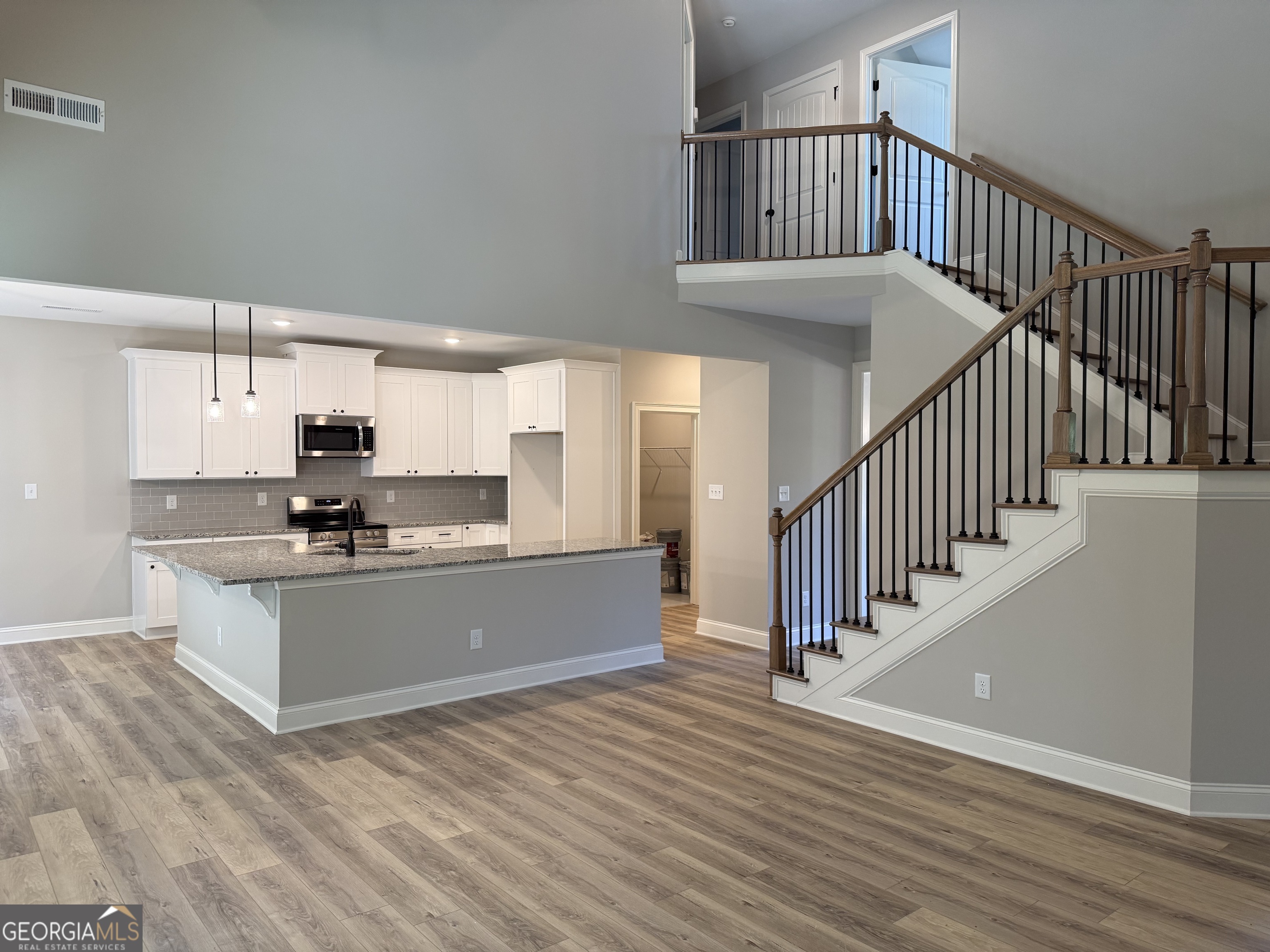 92 Commanche Circle Williamson, GA 30292 - Photo 16 of 53 a view of kitchen with sink and wooden floor